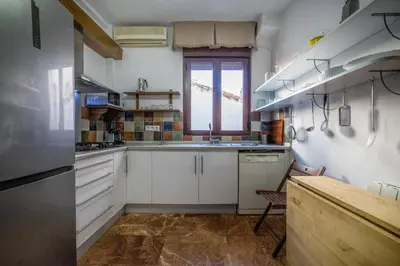 Una cocina o zona de cocina en Apartamento con patio cordobés en San Basilio & Parking