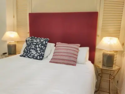 Cama o camas de una habitación en HomeySeville-Bright Apartment at Santa Cruz 4 pax, Parking Optional