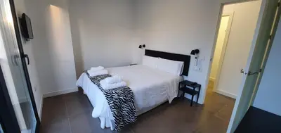 Cama o camas de una habitación en RICARDO APARTAMENTo