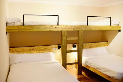 Cama o camas de una habitación en Azul añil EL PATIO Casa rural en Alameda