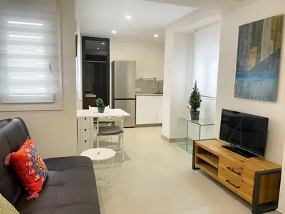 Una televisión o centro de entretenimiento en Eva Recommends San Lorenzo