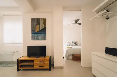 Una televisión o centro de entretenimiento en Eva Recommends San Lorenzo