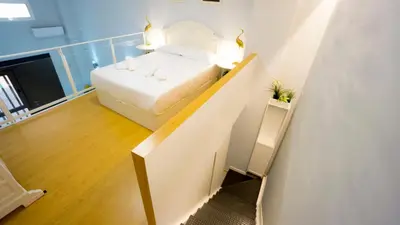 Cama o camas de una habitación en RentalSevilla Escuelas Pías