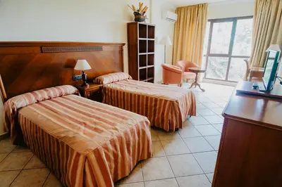 Cama o camas de una habitación en Hotel Hacienda Don Manuel