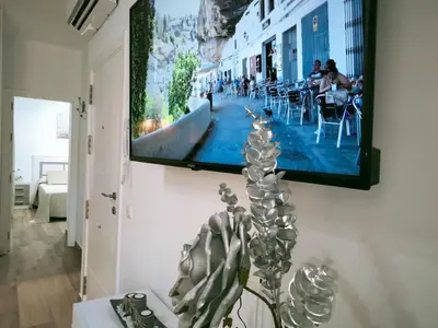 Una televisión o centro de entretenimiento en Ático CARMEN