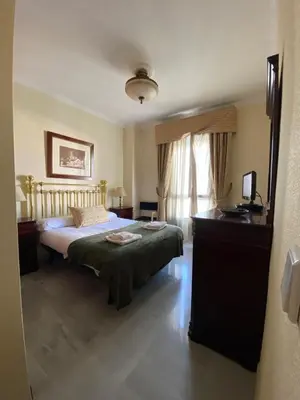 Cama o camas de una habitación en fantástico apartamento con parking avenida de cadiz