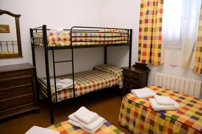 Cama o camas de una habitación en Casa Rural LA ENCINA