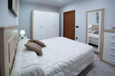 Cama o camas de una habitación en Apartamentos Maquinista
