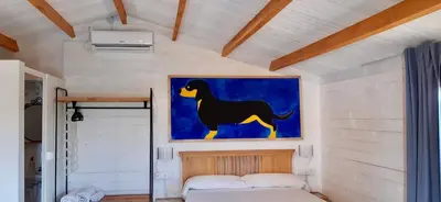 Cama o camas de una habitación en Hermoso Bungalow de madera