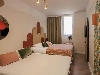 Cama o camas de una habitación en Ibis Styles Sevilla City Santa Justa