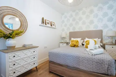 Cama o camas de una habitación en NEW APARTMENT IN TRADITIONAL BUILDING OF THE XVI CENTURY
