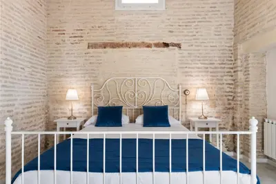 Cama o camas de una habitación en Unika Homes Hombre de Piedra