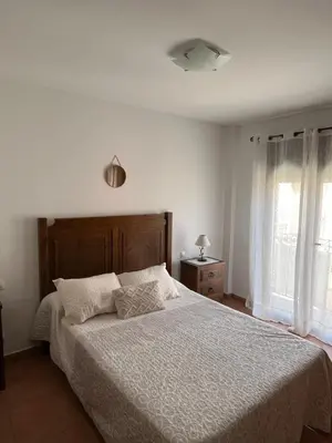 Cama o camas de una habitación en Apartamentos turísticos Rutas del Torcal 1A