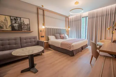 Cama o camas de una habitación en Hotel Giralda Center