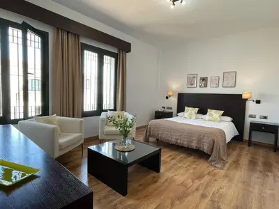 Cama o camas de una habitación en Hotel Cuatro Vientos