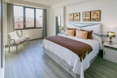 Cama o camas de una habitación en Geysotur Gran Capitán Uno