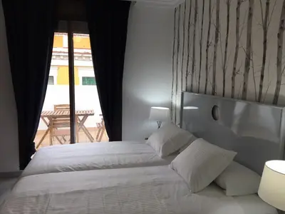 Cama o camas de una habitación en Correduria Premium Apartments
