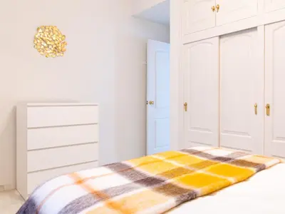 Cama o camas de una habitación en La Casa de los Naranjos