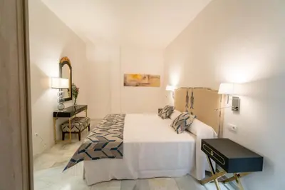 Cama o camas de una habitación en Arco Macarena Lofts by SHS