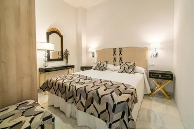 Cama o camas de una habitación en Arco Macarena Lofts by SHS