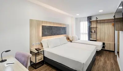 Cama o camas de una habitación en Sercotel Córdoba Delicias