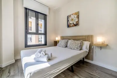 Cama o camas de una habitación en Apartamentos Dama de noche
