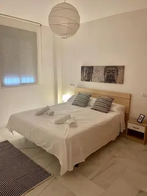 Cama o camas de una habitación en Bj. A Apartamentos Arguiñan