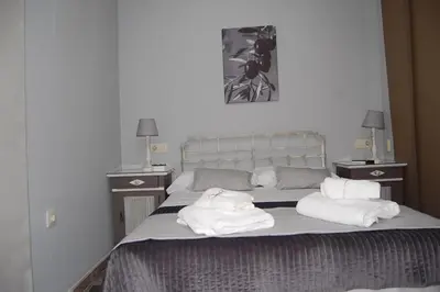Cama o camas de una habitación en Apartamentos Los Jardines& Parking