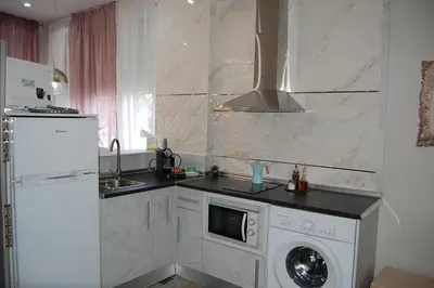 Una cocina o zona de cocina en Apartamentos Los Jardines& Parking