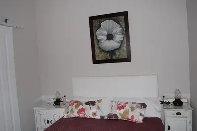 Cama o camas de una habitación en Apartamentos Los Jardines& Parking