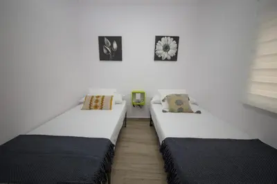Cama o camas de una habitación en Luminoso piso junto al Mercado de Feria