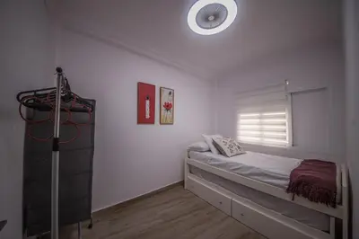 Cama o camas de una habitación en Luminoso piso junto al Mercado de Feria