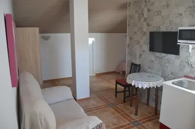 Una televisión o centro de entretenimiento en Apartamento en Olvera