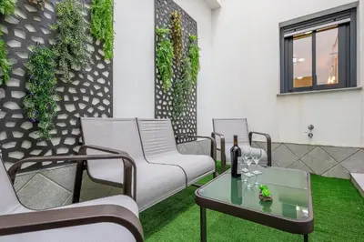 Zona de estar de Family suit principal encantos de Sevilla