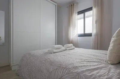 Cama o camas de una habitación en Family suit principal encantos de Sevilla
