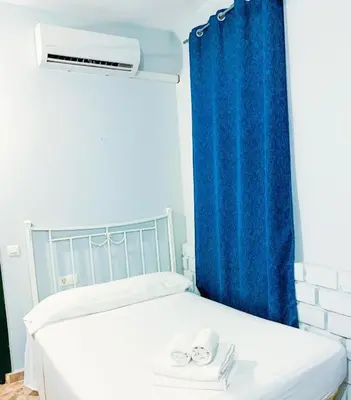 Cama o camas de una habitación en Hostal El Castillo Alcala De Guadaira