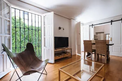Una televisión o centro de entretenimiento en Magno Apartments Vidrio