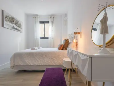 Cama o camas de una habitación en Family HOME SUITS Encantos de Sevilla