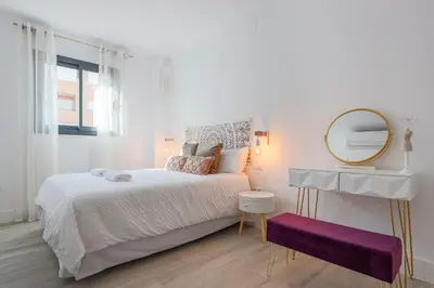 Cama o camas de una habitación en Family HOME SUITS Encantos de Sevilla
