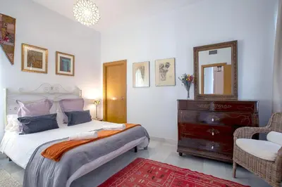 Cama o camas de una habitación en Vidrio Sevilla Deluxe Apartment