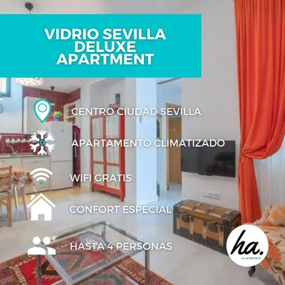 Una televisión o centro de entretenimiento en Vidrio Sevilla Deluxe Apartment