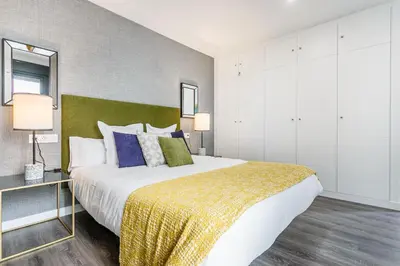 Cama o camas de una habitación en Precioso Ático de diseño, gran Terraza de 35 m2 y de 16 m2 y Garaje en pleno Centro