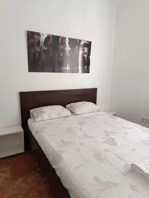 Cama o camas de una habitación en Piso dos dormitorios junto plaza Colón