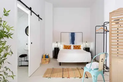 Cama o camas de una habitación en MonKeys Apartments PinoLoft Nuevo Torneo