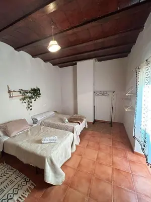 Cama o camas de una habitación en Cortijo La Torquilla Laguna Fuente de Piedra