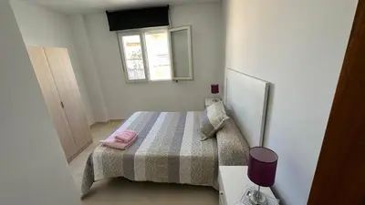 Cama o camas de una habitación en APARTAMENTO el CARMEN