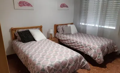 Cama o camas de una habitación en APARTAMENTO SAN LORENZO