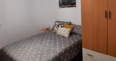 Cama o camas de una habitación en APARTAMENTO SAN LORENZO