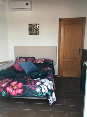 Cama o camas de una habitación en HACIENDA LA MACARENA DE SEVILLA