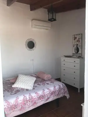 Cama o camas de una habitación en HACIENDA LA MACARENA DE SEVILLA